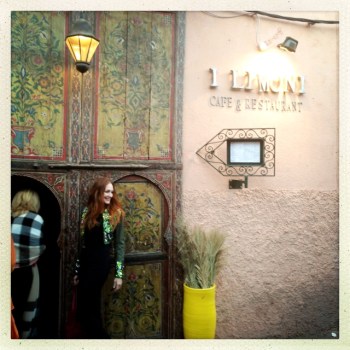 Erica outside a restaurant in the walled city. The streets are narrow and the world opens up behind beautiful doors. Homes and restaurants have gardens and atriums and you eat outside