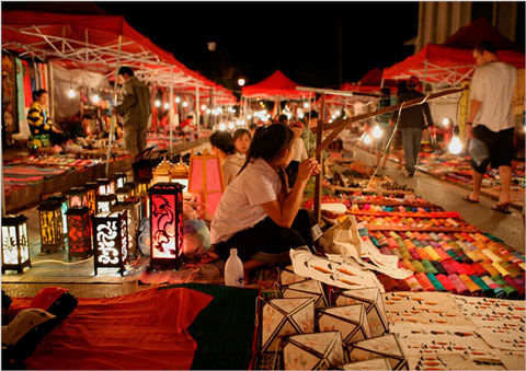 The money shot - as in where we all spent our money. The night market in Luang Prabang is great for little gifts and keep sakes, especially textiles, and we all went nuts for shockingly bright bags with pom poms (when in Rome...)
